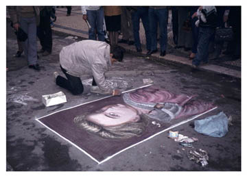 photo of pavement artist in Portugal